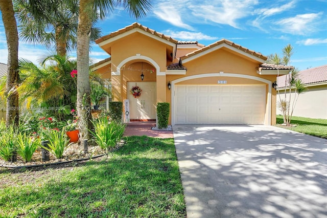 mediterranean / spanish house featuring stucco siding, concrete driveway, an attached garage, and a tiled roof
