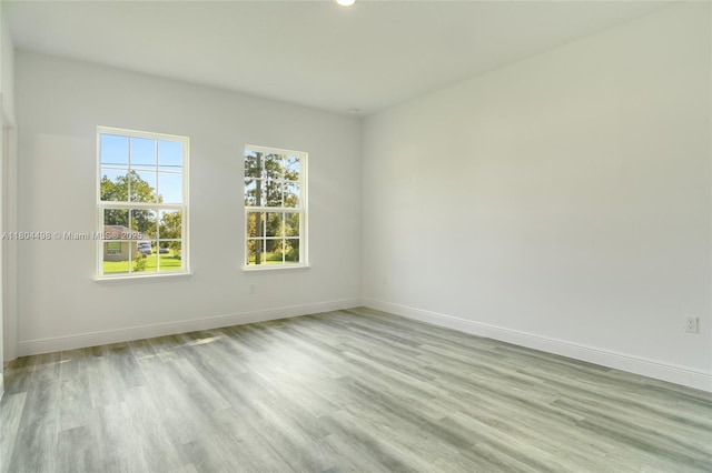 5998 SW 128th Street Rd, Ocala, FL 34473 - spare room with baseboards, wood finished floors, and recessed lighting