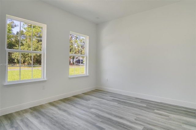5998 SW 128th Street Rd, Ocala, FL 34473 - empty room with baseboards and light wood finished floors