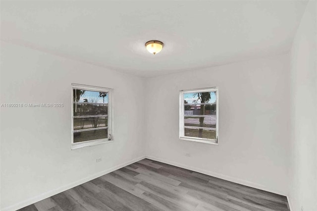 15351 SW 296th St, Homestead, FL 33033 - unfurnished room featuring healthy amount of natural light, wood finished floors, and baseboards