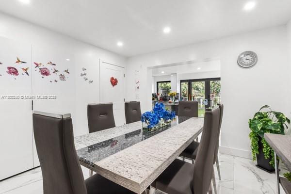 1594 W 73rd St, Hialeah, FL 33014 - dining area featuring light marble finish floors, recessed lighting, and baseboards
