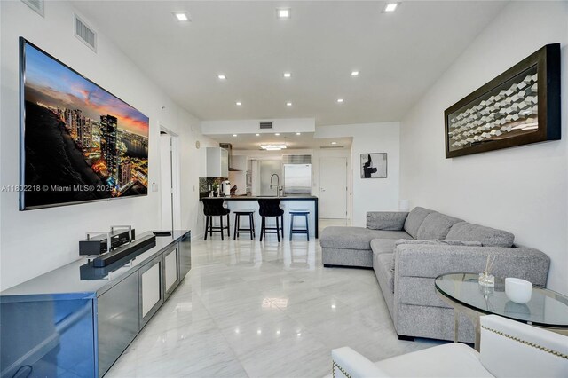 18201 Collins Ave Unit 808, Sunny Isles Beach, FL 33160 - living room featuring light marble finish floors and recessed lighting