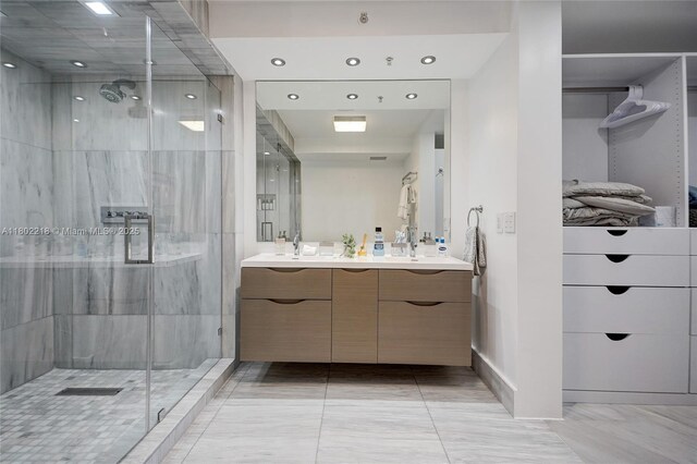 18201 Collins Ave Unit 808, Sunny Isles Beach, FL 33160 - full bath with a shower stall, double vanity, recessed lighting, and marble finish flooring