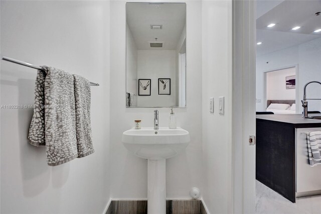 18201 Collins Ave Unit 808, Sunny Isles Beach, FL 33160 - bathroom with a sink, baseboards, and recessed lighting