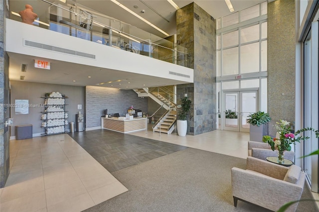 18201 Collins Ave Unit 808, Sunny Isles Beach, FL 33160 - common area with a towering ceiling and stairs
