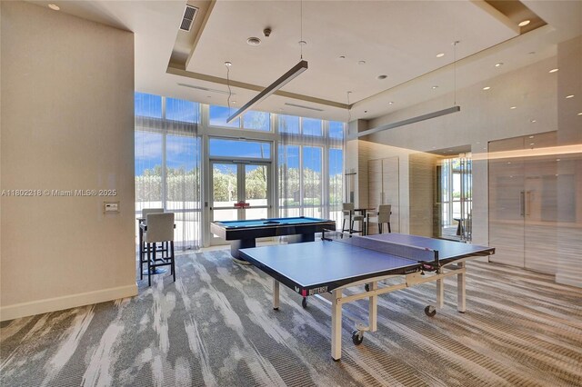 18201 Collins Ave Unit 808, Sunny Isles Beach, FL 33160 - recreation room featuring a high ceiling, french doors, billiards table, a raised ceiling, and a wall of windows