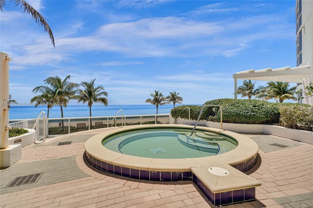 18201 Collins Ave Unit 808, Sunny Isles Beach, FL 33160 - view of swimming pool featuring a water view and an in-ground hot tub