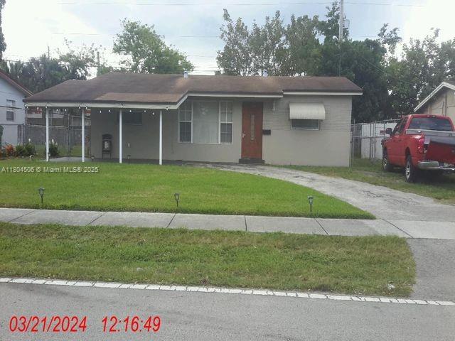 3048 NW 20th St, Fort Lauderdale, FL 33311 - single story home with driveway