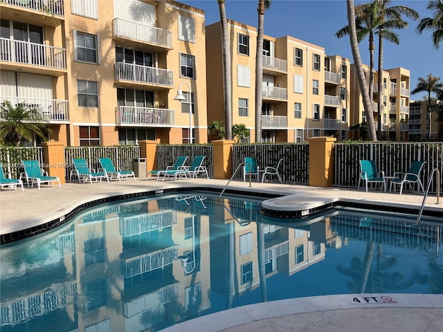 1450 SE 3rd Ave Unit 208, Dania Beach, FL 33004 - community pool with fence and a patio area