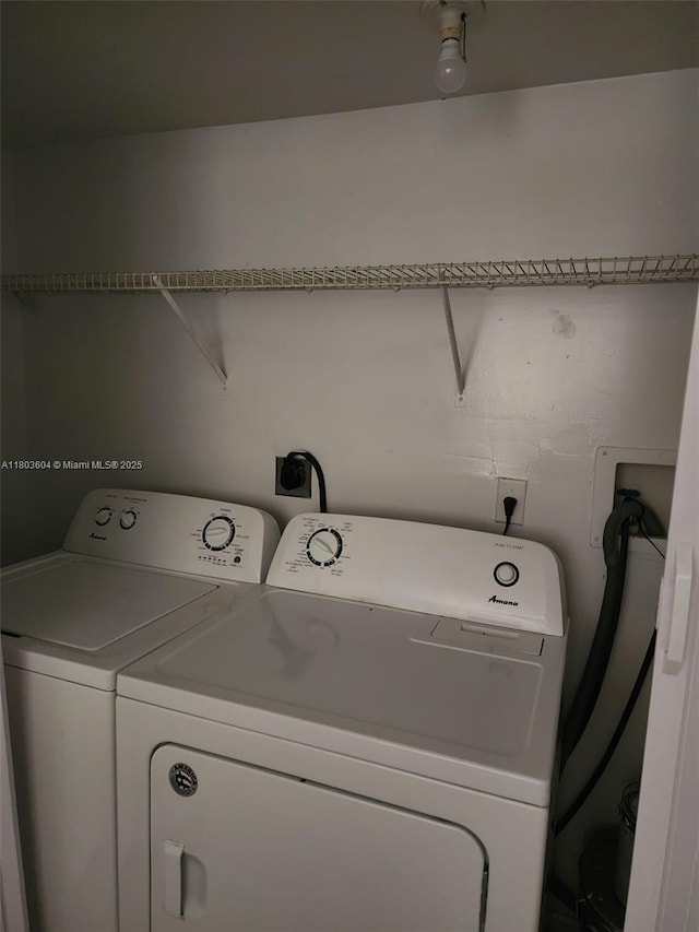 1450 SE 3rd Ave Unit 208, Dania Beach, FL 33004 - laundry area featuring washing machine and dryer