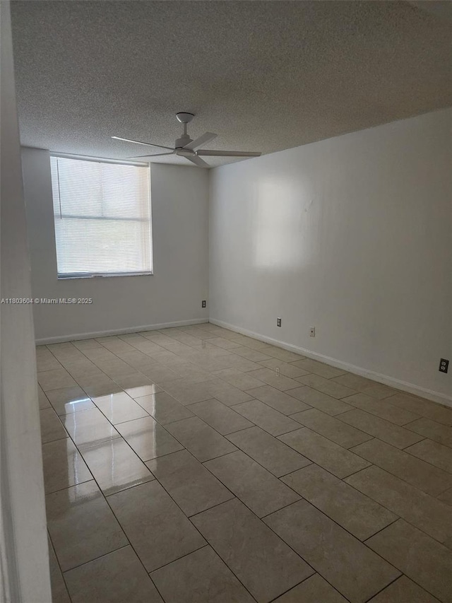 1450 SE 3rd Ave Unit 208, Dania Beach, FL 33004 - unfurnished room featuring a ceiling fan, tile patterned flooring, a textured ceiling, and baseboards