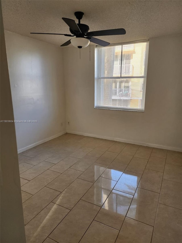 1450 SE 3rd Ave Unit 208, Dania Beach, FL 33004 - unfurnished room with a textured ceiling, light tile patterned flooring, a ceiling fan, and baseboards