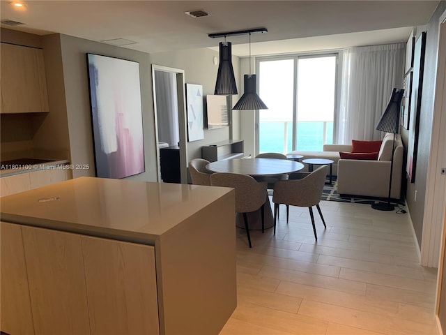 4010 S Ocean Dr Unit R3407, Hollywood, FL 33019 - kitchen featuring modern cabinets, light countertops, a center island, and light wood-style flooring