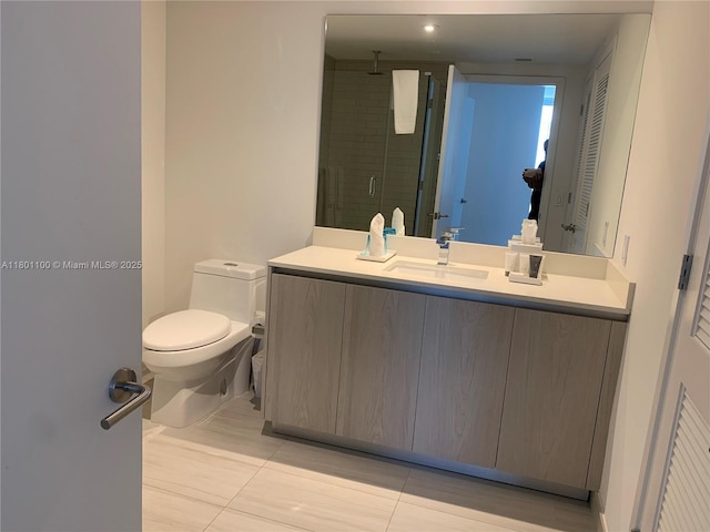 4010 S Ocean Dr Unit R3407, Hollywood, FL 33019 - full bathroom featuring a stall shower, toilet, vanity, and tile patterned floors