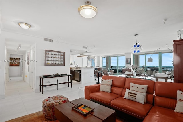3400 SW 27th Ave Unit 1102, Miami, FL 33133 - living area featuring light tile patterned floors and floor to ceiling windows