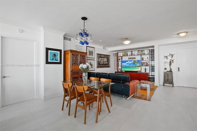 3400 SW 27th Ave Unit 1102, Miami, FL 33133 - dining room with ornamental molding and a chandelier