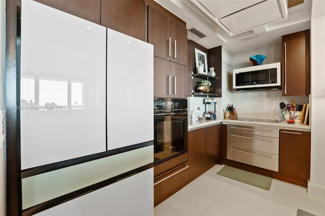 3400 SW 27th Ave Unit 1102, Miami, FL 33133 - kitchen featuring black appliances, open shelves, light countertops, light tile patterned floors, and dark brown cabinetry