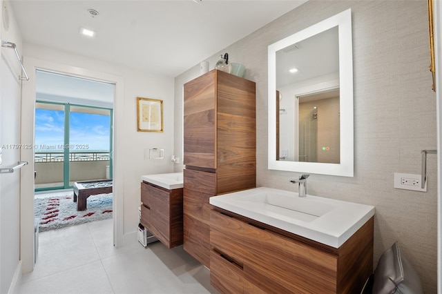 3400 SW 27th Ave Unit 1102, Miami, FL 33133 - bathroom with two vanities and tile patterned floors