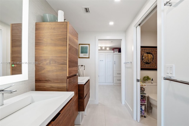 3400 SW 27th Ave Unit 1102, Miami, FL 33133 - full bath featuring tile patterned flooring, vanity, toilet, and recessed lighting