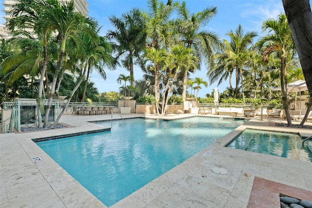 3400 SW 27th Ave Unit 1102, Miami, FL 33133 - community pool with a patio area and fence