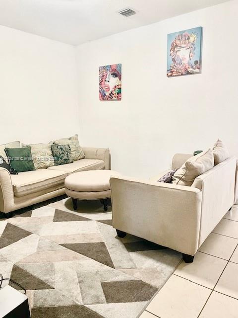 380 NE 37th Ter, Homestead, FL 33033 - living area with light tile patterned floors