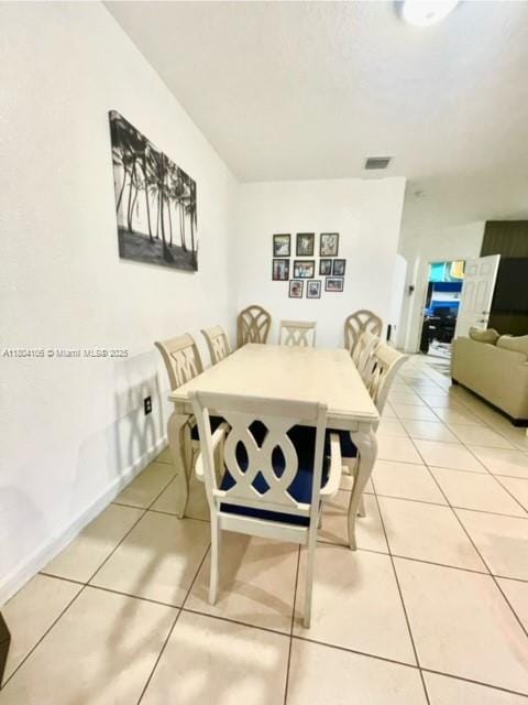 380 NE 37th Ter, Homestead, FL 33033 - dining space with light tile patterned floors