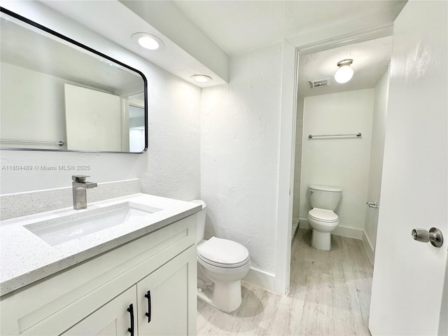 6890 N Kendall Dr Unit B204, Pinecrest, FL 33156 - bathroom featuring toilet, vanity, wood finished floors, and baseboards