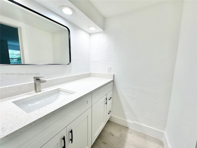 6890 N Kendall Dr Unit B204, Pinecrest, FL 33156 - bathroom featuring vanity, baseboards, a textured wall, and recessed lighting