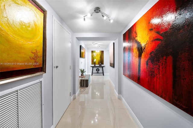 1900 N Bayshore Dr Unit 2512, Miami, FL 33132 - hallway featuring tile patterned floors, baseboards, and rail lighting