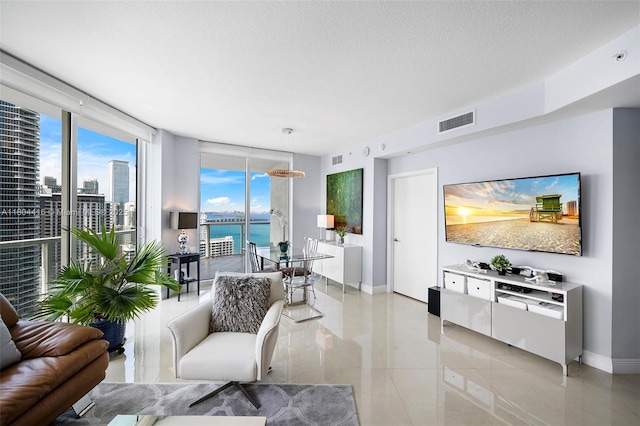 1900 N Bayshore Dr Unit 2512, Miami, FL 33132 - living area featuring baseboards, plenty of natural light, a textured ceiling, and light tile patterned flooring