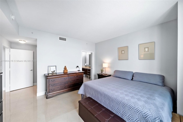 1900 N Bayshore Dr Unit 2512, Miami, FL 33132 - bedroom with light tile patterned floors and ensuite bath