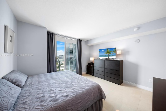 1900 N Bayshore Dr Unit 2512, Miami, FL 33132 - bedroom featuring baseboards and light tile patterned floors