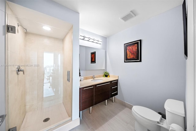 1900 N Bayshore Dr Unit 2512, Miami, FL 33132 - bathroom featuring toilet, a shower stall, vanity, and baseboards