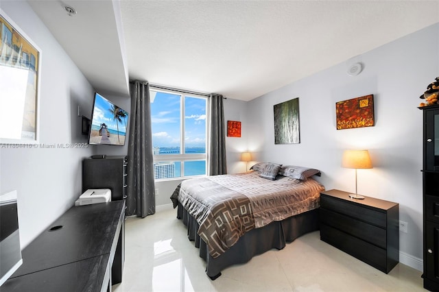 1900 N Bayshore Dr Unit 2512, Miami, FL 33132 - bedroom with light tile patterned flooring and baseboards