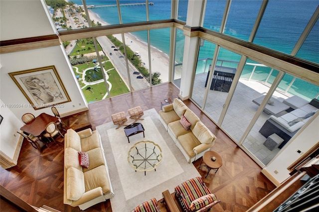 6051 N Ocean Dr Unit Ph5, Hollywood, FL 33019 - living room featuring a water view and a towering ceiling