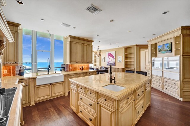 6051 N Ocean Dr Unit Ph5, Hollywood, FL 33019 - kitchen with a sink, dark wood-style floors, cream cabinets, tasteful backsplash, and recessed lighting