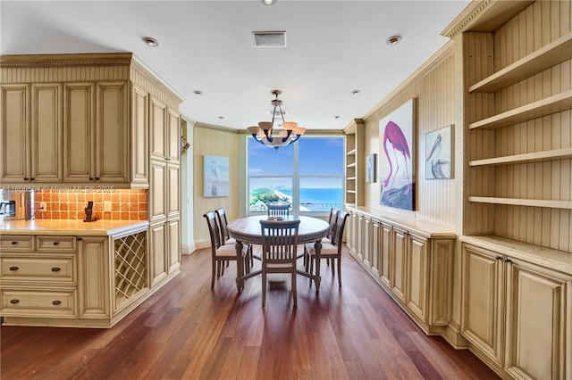 6051 N Ocean Dr Unit Ph5, Hollywood, FL 33019 - dining area with a chandelier, dark wood-style floors, ornamental molding, built in features, and baseboards