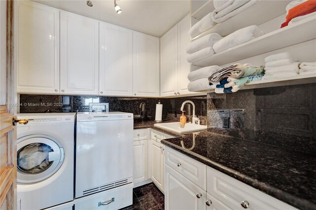 6051 N Ocean Dr Unit Ph5, Hollywood, FL 33019 - washroom featuring cabinet space, separate washer and dryer, and granite tiled floors