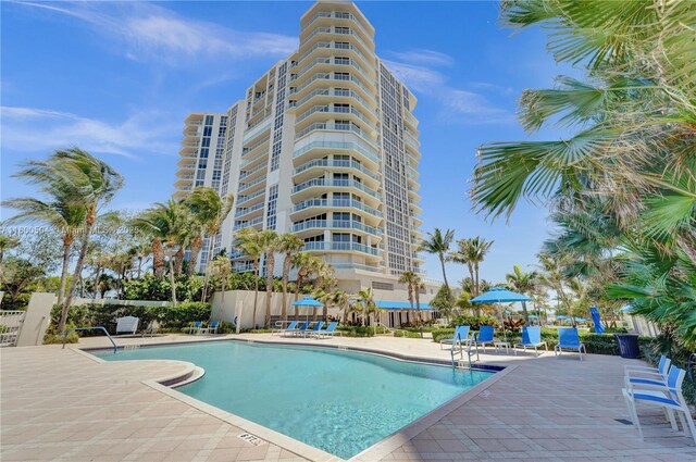 6051 N Ocean Dr Unit Ph5, Hollywood, FL 33019 - community pool featuring a patio and fence