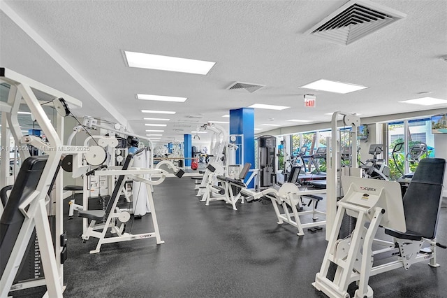 6051 N Ocean Dr Unit Ph5, Hollywood, FL 33019 - exercise room with a textured ceiling