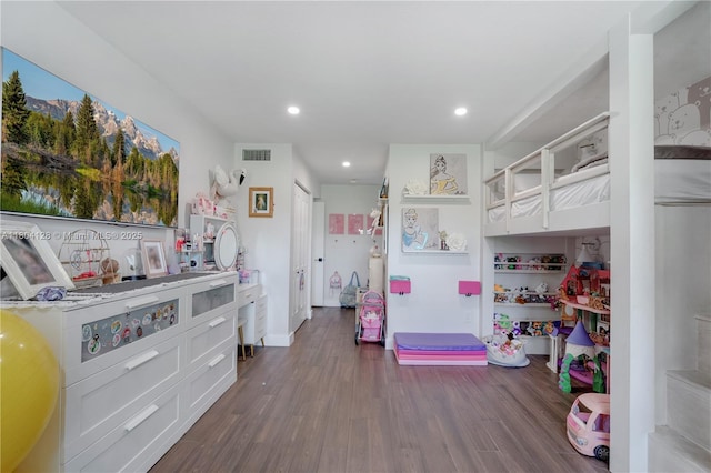 bedroom featuring dark wood-style flooring and recessed lighting