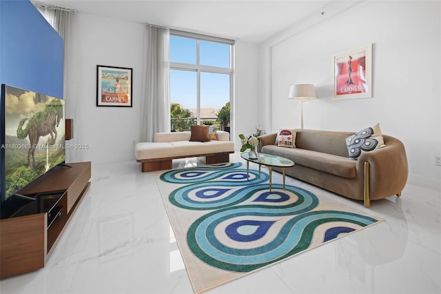living area with marble tiled floors