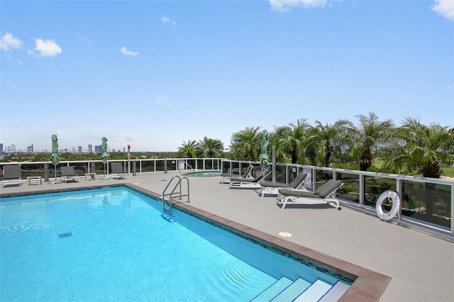 community pool with a patio area