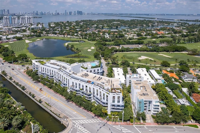 drone / aerial view of a large body of water and a golf course