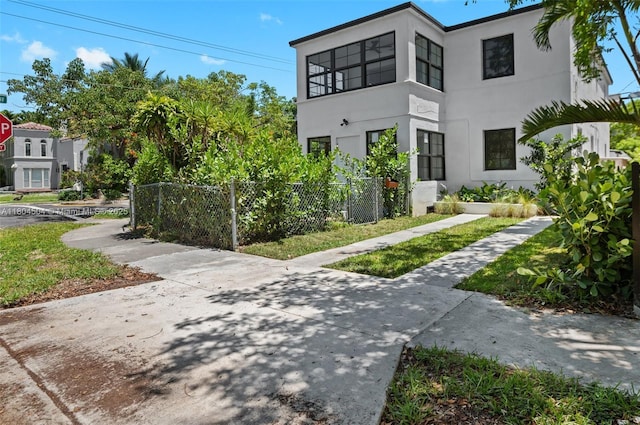 4222 NE 1st Ave, Miami, FL 33137 - view of home's exterior with stucco siding and fence