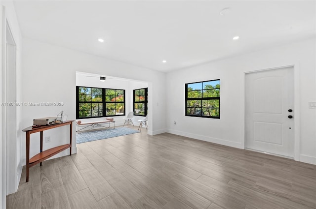4222 NE 1st Ave, Miami, FL 33137 - unfurnished living room with plenty of natural light, light wood finished floors, recessed lighting, and baseboards