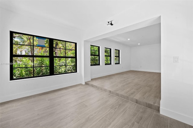 4222 NE 1st Ave, Miami, FL 33137 - unfurnished room with baseboards and wood finished floors