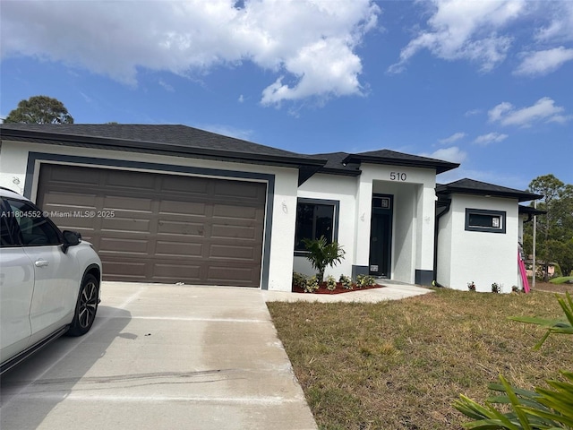 3004 SW 4th St, Lehigh Acres, FL 33976 - prairie-style house featuring concrete driveway, an attached garage, stucco siding, and a front lawn