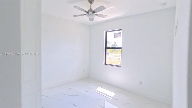 3004 SW 4th St, Lehigh Acres, FL 33976 - unfurnished room featuring marble finish floors, ceiling fan, and baseboards