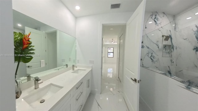 3004 SW 4th St, Lehigh Acres, FL 33976 - bathroom with marble finish floors, a marble finish shower, recessed lighting, double vanity, and baseboards